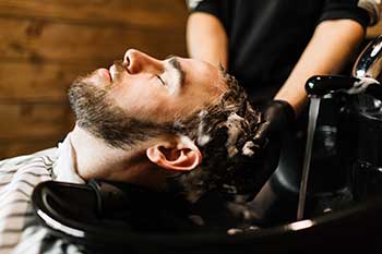 Customer having hair washed.